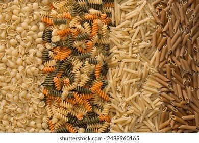 Close-up full frame color background photo of various types of uncooked pasta noodles. - Powered by Shutterstock