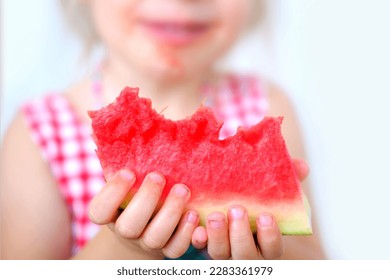 close-up funky hipster blonde girl eating ripe red watermelon, juicy slice in hands of child, toddler, dirty mouth, happy childhood, good appetite, balanced diet, sweet life, healthy food - Shutterstock ID 2283361979