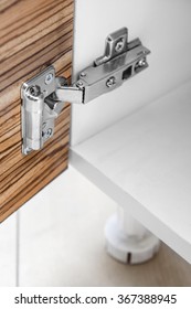 Closeup Of Furniture Cabinet Modern Clip Hinge With Amortization - Kitchen Slow Motion Hardware