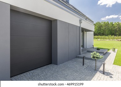 Close-up Of Garage Door And Driveway Of Modern House