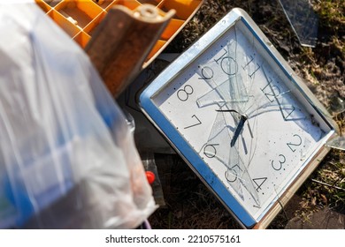 Closeup Of A Garbage And Broken Clock With Smashed Face And Hands