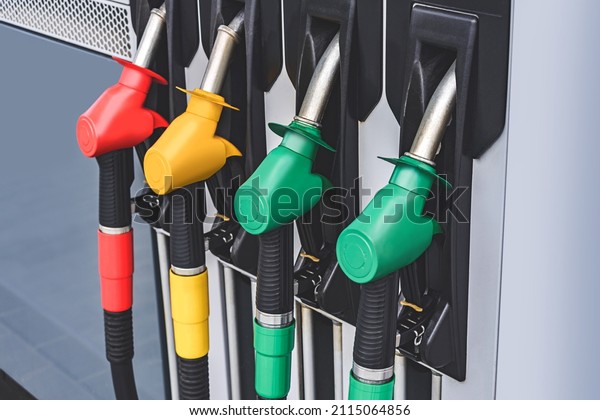 Close-up, gas station\
with refueling\
pistols