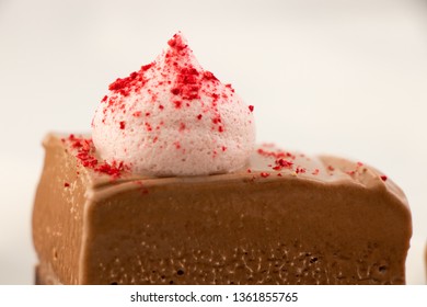 A Closeup Of A Gateau Marcel With Dried Rasberry On Top