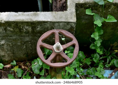 Closeup of Gear for controlling the floodgate in the canal with natural background at Thailand. - Powered by Shutterstock