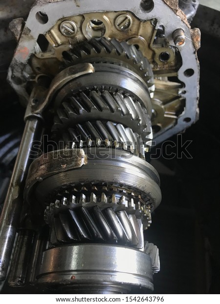 Close-up gear transmission,Gears transmission with\
shallow depth of field, Car\'s gear box detail,engine gears wheels\
of car,close-up view.