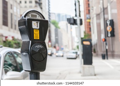 Close-up of a generic american parking meter in the streets of downtown chicago with large copy space, usa.