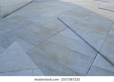 Close-up of the geometric stone patterns on the Oslo Opera House in Oslo, Norway. The textured tiles showcase modern Scandinavian architecture and design