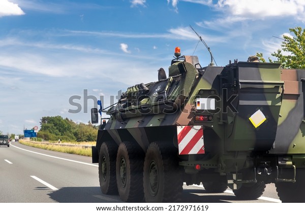 Close-up German armoured personnel carrier\
fuchs drive military convoy highway road. ALLIANCE troops moving\
reloceation rapid reaction force reinforcement eastern Europe.\
Sweden Finland\
fortification