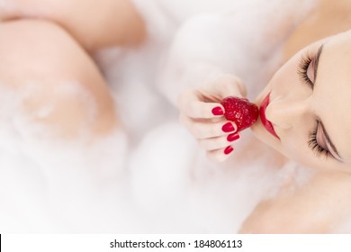 Closeup Girl In Bathroom With White Foam And Strawberry