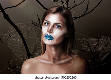 Close-up of a girl with a creative make-up scary and creepy halloween
