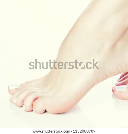 Close-up girl feet. Part of leg of woman dancer. Perfect skin, fresh nail polish pecicure. Body care health concept