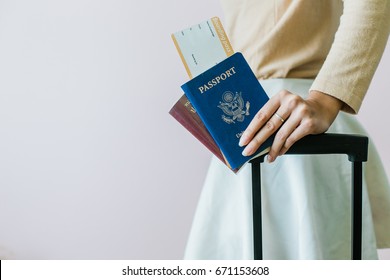 Closeup Of Girl Holding Passports And Boarding Pass