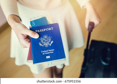 Closeup Of Girl Holding Passports And Boarding Pass