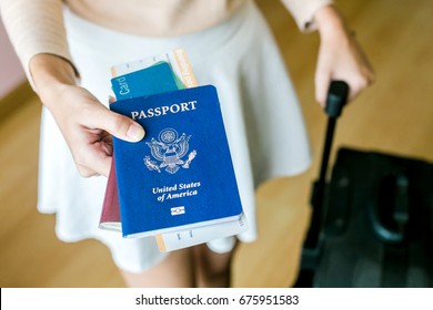 Closeup Of Girl Holding Passports And Boarding Pass