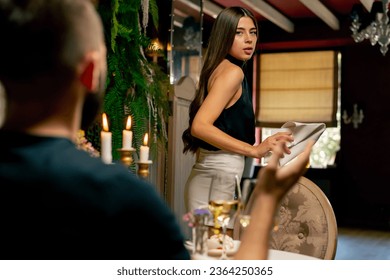 Close-up of a girl leaving a date with her boyfriend because of an argument during a date at Italian restaurant