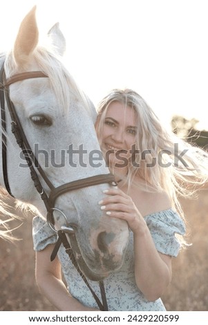 Similar – Image, Stock Photo Portrait of adult woman with beautiful horse in nature. Sunlight, silhouette.Concept of love for lesser brothers, caring and animal training