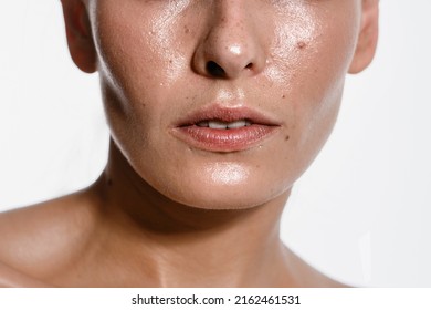close-up girl with sweaty skin on her face and excessive oily sheen, excessive sweating, hyperhidrosis disease - Shutterstock ID 2162461531
