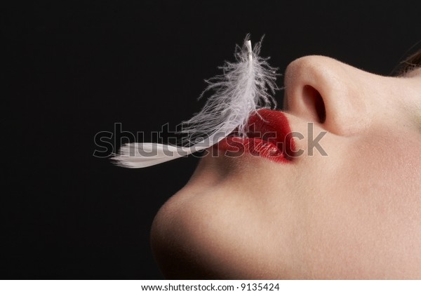 closeup-girl-white-feather-over-600w-913