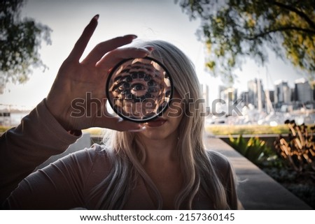 A closeup of a girls eyes reflected through a kaleidoscope