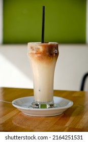 Close-up of a glass of authentic Horchata de Chufa with coffee shaved ice. It is a Mediterranean tradition of grain-based beverages and is made with dried and sweetened tiger nuts.