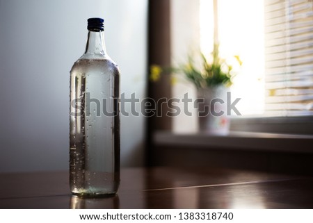 Close-up of glass bottle for water