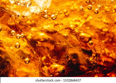 Close-up Of Glass Of Cola,Cola With Ice. Food Background ,Cola, Soda, Bubble, Carbonated, Ice,Abstract, Backgrounds, Black Color, Bright,Pour Cola From The Bottle To Glass And Bubble Soda On Black.