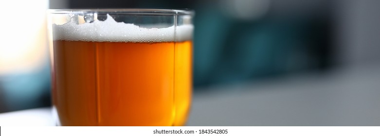 Close-up Of Glass Filled With Light Or Dark Beer. Cold Fresh Drink In Hot Summer Weather. Space For Text Or Advertisement. Copy Space In Right Side. Alcoholic Beverage Concept