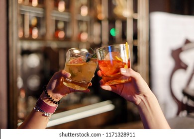 Close-up Glass  Of Friends Clinking Glasses Of Whiskey