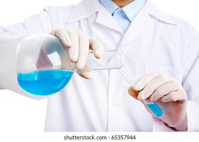 Close-up of glass tubes with fluid in doctor hands during medical test - Shutterstock ID 65357944