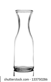 Closeup of a glass wine carafe isolated on white with reflection.