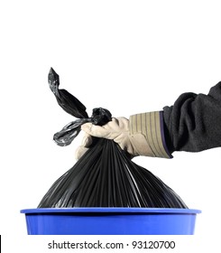 Closeup Of A Gloved Hand Taking A Trash Bag Out Of A Blue Container