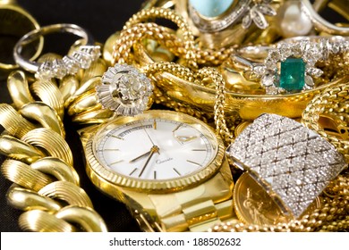 Closeup Of Gold Jewelery With Precious Stones