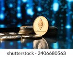 Closeup of golden Ethereum cryptocurrency surrounded by more coins and defocused stars background