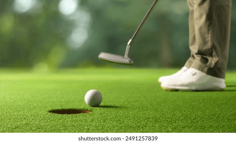 Close-up golf ball after putting to the golf hole. - Powered by Shutterstock