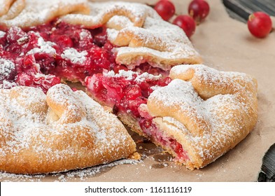 Closeup Of Gooseberry Galette. Cut Off Sector. Blurred Background.