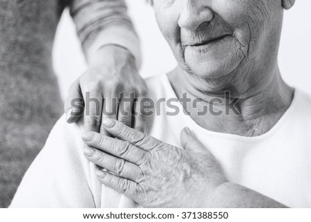 Close-up of granddaughter caring about grandma
