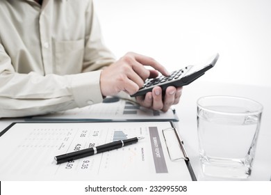 Close-up of graphs and charts analyzed by businessman