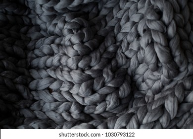 Close-up Gray Knitted Blanket, Merino Wool Background.