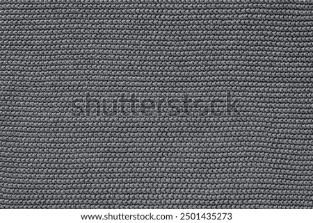Close-up of gray knitted wool texture background