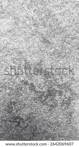 Close-up of gray textured stone surface with rough patterns.