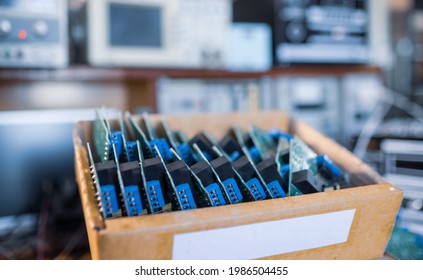 Close-up green embedded microcircuits are stacked in box to prepare for the further in factory for production of equipment