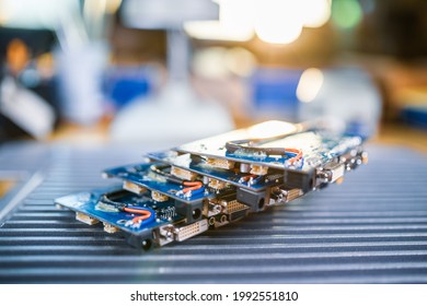Close-up green embedded microcircuits are stacked on test plate to prepare for the further production of computer in factory for production of equipment