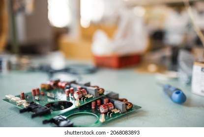 Close-up Green Embedded Microcircuits Are Stacked On Test Plate To Prepare For The Further Production Of Computer In Factory For Production Of Equipment