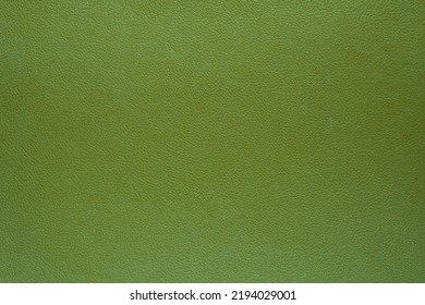 Close-up Of Green Fabric Leather Plastic Textile. Genuine Leather Texture Background. Green Canvas Texture Background.