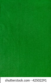 Close-up of a green poker table felt surface