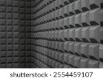 Close-up of grey acoustic foam wall. Abstract geometric texture background. Abstract Grey Acoustic Foam Wall Texture Acoustic Foam Panel for Sound Absorption or soundproofed room.