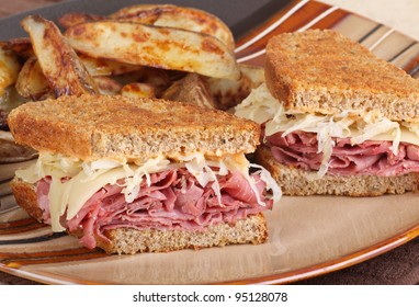 Closeup Of A Grilled Reuben Sandwich With Pastrami And Swiss Cheese On A Plate