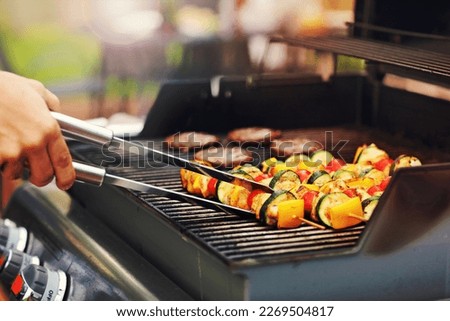 Closeup of grilled shashliks on grate