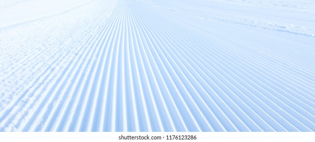 Close-up groomed snow at ski resort, slope banner background texture - Powered by Shutterstock