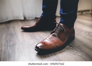 A Closeup Of A Groomsman Wearing Cap Toe Shoes